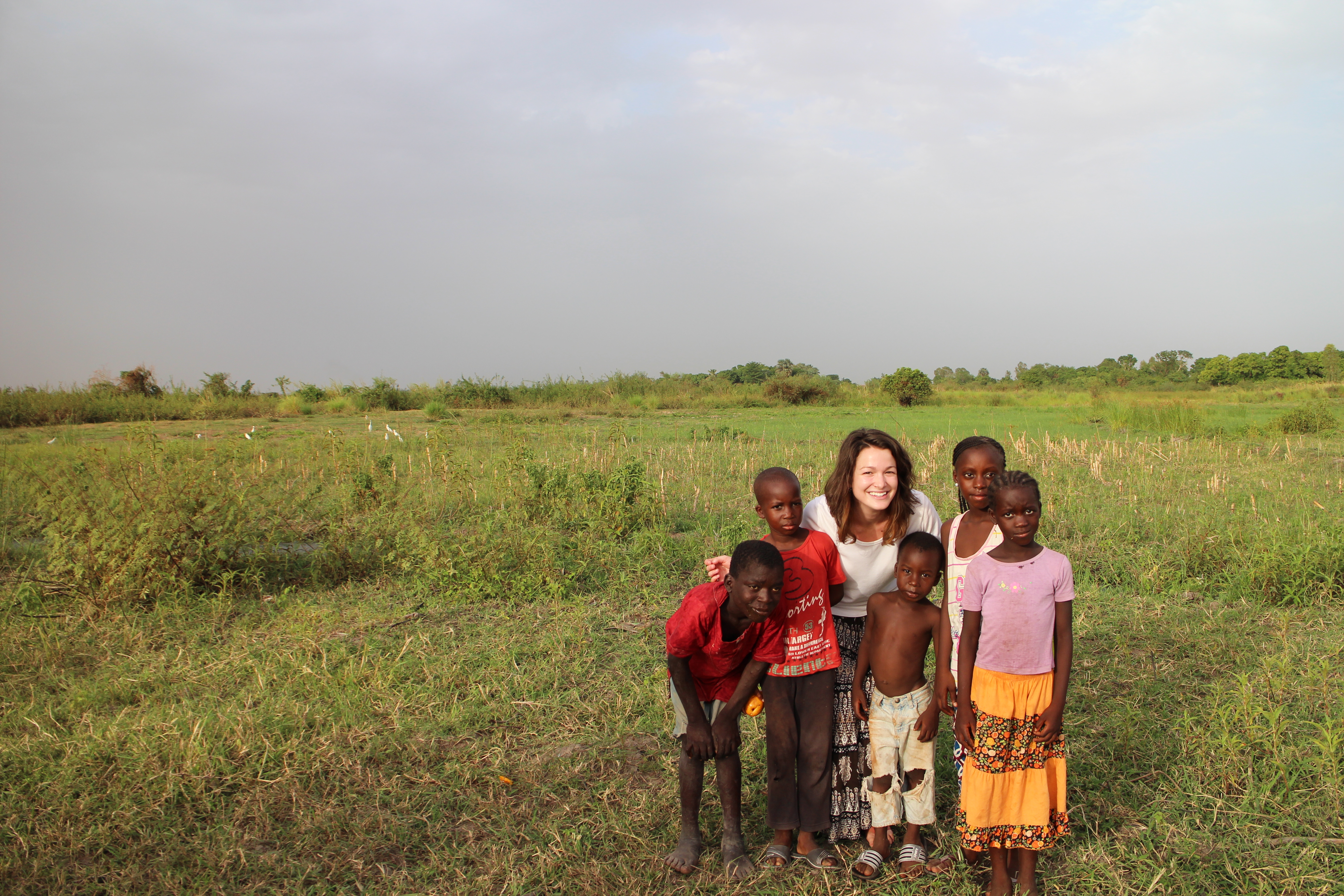 Peace Corps volunteer with a group of children